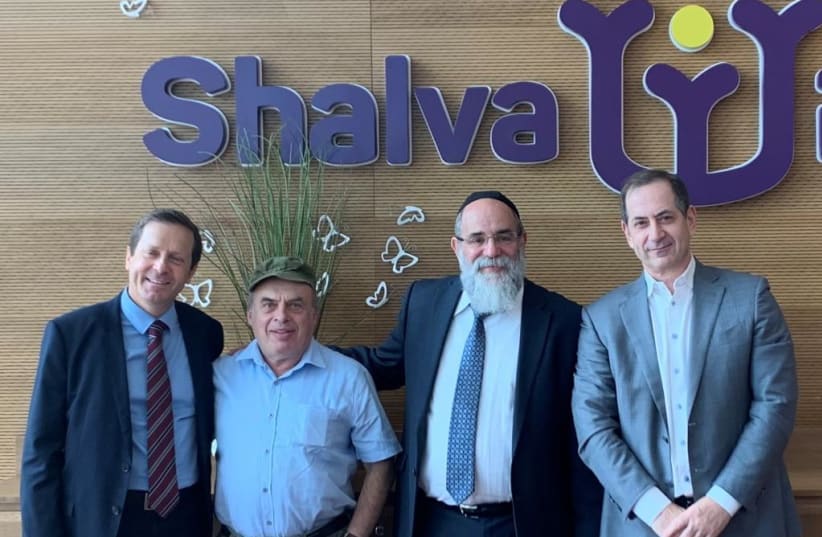  Isaac Herzog, then Chairman of the Jewish Agency for Israel, Trustee of the Genesis Prize Foundation Natan Sharansky, Founder of Shalva, Rabbi Kalman Samuels, and Founder and CEO of Genesis Prize Foundation Stan Polovets at the Shalva National Center in Jerusalem, Israel in 2019. (photo credit: GENESIS PRIZE FOUNDATION)