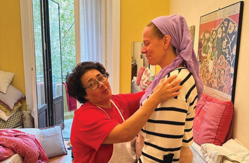  THE WRITER is hugged by the family’s Italian housekeeper. (photo credit: Courtesy Hadassah Chen)