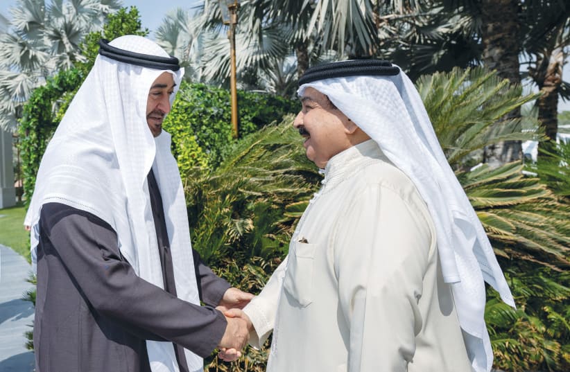  UAE PRESIDENT Sheikh Mohammed bin Zayed Al Nahyan (left) and Bahrain’s King Hamad bin Isa Al Khalifa meet in Abu Dhabi, last week.  (photo credit: UAE Presidential Court/Reuters)