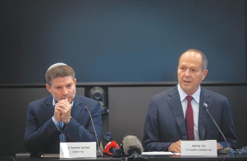 FINANCE MINISTER Bezalel Smotrich and Economy Minister Nir Barkat attend a meeting in September.  (photo credit: Chaim Goldberg/Flash90)