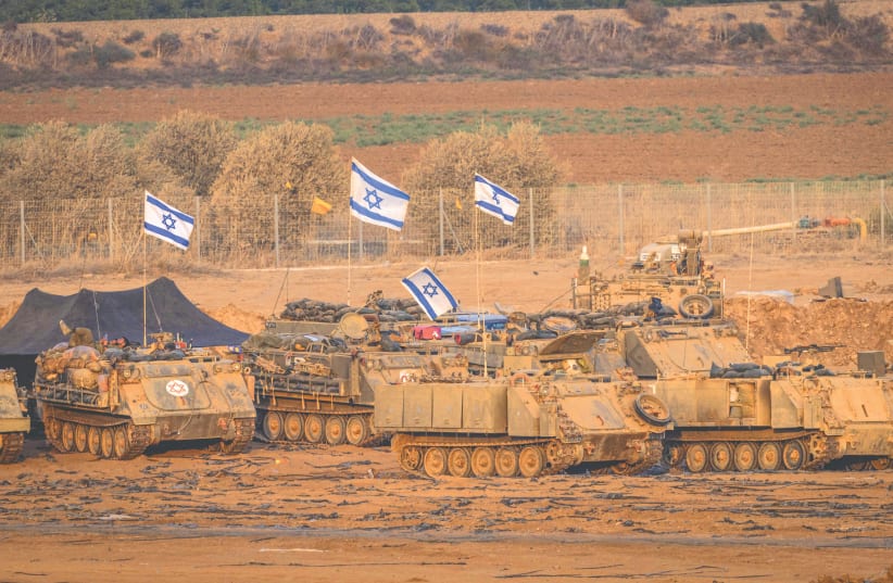  ARMORED IDF VEHICLES are seen during their ground operations at a location inside Gaza, in an image released on Wednesday by the IDF. (photo credit: REUTERS)