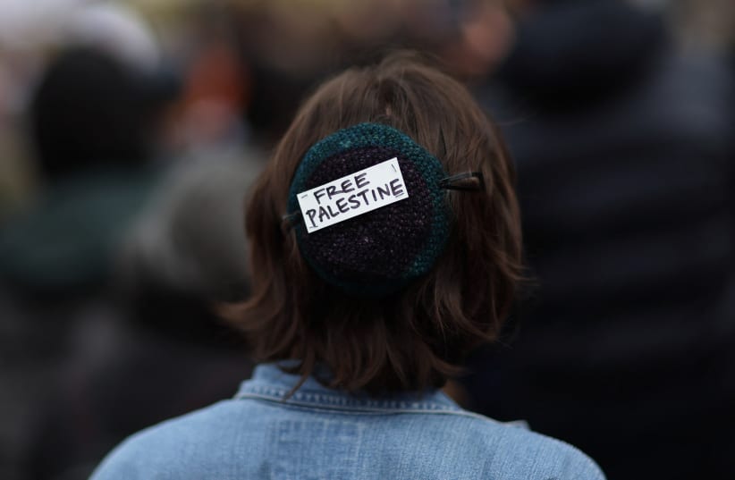  AN ACTIVIST wears a kippah with a political message during a protest against Israel in Washington, DC, on October 18.  (photo credit: LEAH MILLIS/REUTERS)