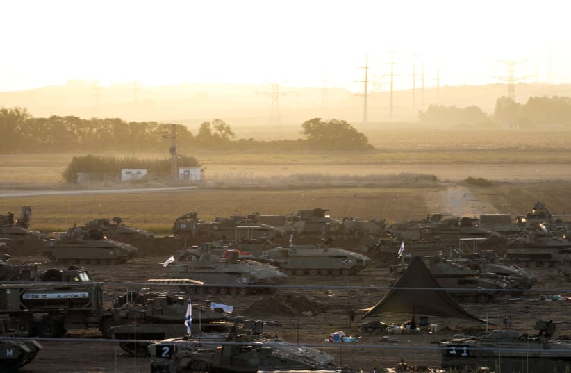  A formation of Israeli tanks and other military vehicles are positioned near Israel's border with the Gaza Strip on October 19 (photo credit: Violeta Santos Moura/Reuters)