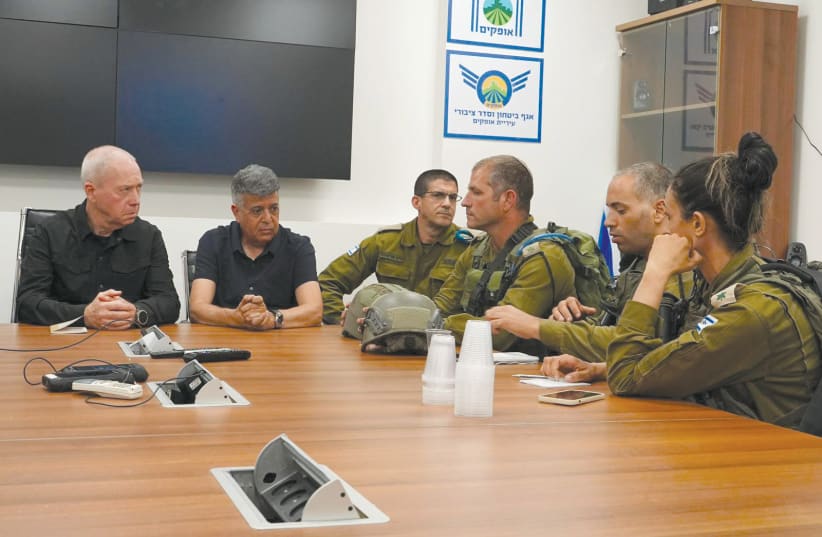  Defense Minister Yoav Gallant meets IDF officers in Ofakim on October 8 (photo credit: ARIEL HERMONI/DEFENSE MINISTRY)