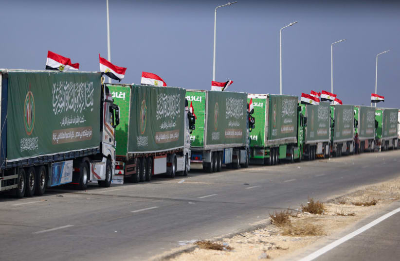  Trucks carrying humanitarian aid for Palestinians, are seen on the day of Egyptian Prime Minister Mostafa Madbouly's visit to the Rafah border crossing between Egypt and the Gaza Strip, amid the ongoing conflict between Israel and Palestinian Islamist group Hamas, in Rafah, Egypt, October 31, 2023. (photo credit: MOHAMED ABD EL GHANY/REUTERS)