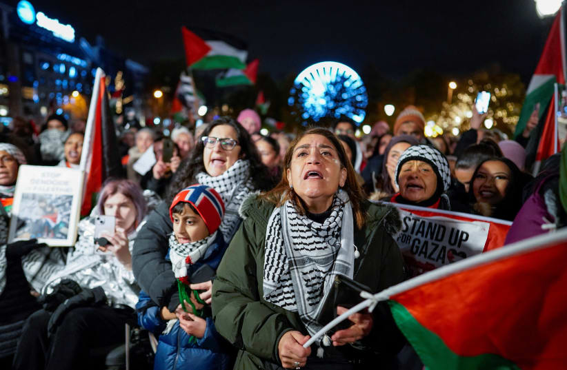  People attend a demonstration in support of Gaza and Palestinians, organised by the Palestine Committee, outside the building of the Norwegian parliament, Stortinget, in Oslo, Norway, November 4, 2023.  (photo credit: NTB/Heiko Junge via REUTERS)