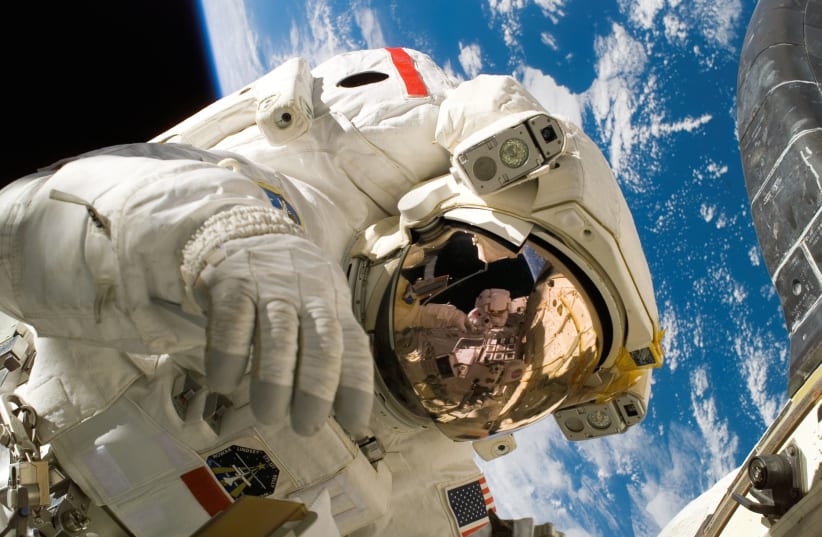  American astronaut in space. (photo credit: PEXELS)