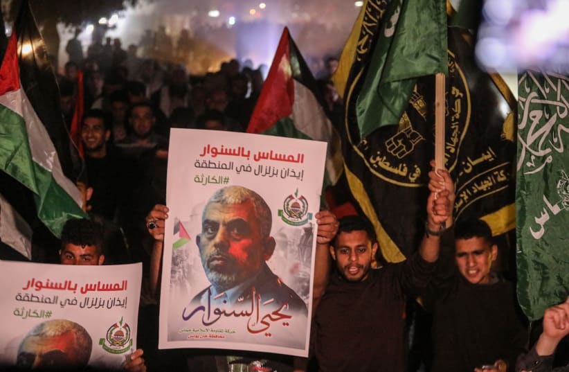  Supporters of Hamas leader Yahya Sinwar protest in Khan Younis, in the southern Gaza Strip, on May 7, 2022 (photo credit: ATTIA MUHAMMED/FLASH90)