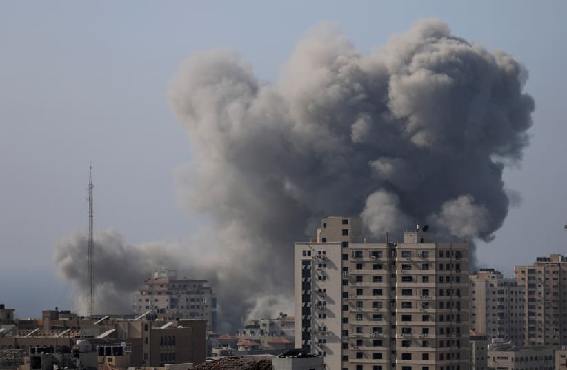  Smoke rises after Israeli strikes, amid the ongoing conflict between Israel and Palestinian Islamist group Hamas, in Gaza City November 6, 2023. (photo credit: REUTERS/MOHAMMED AL-MASRI)
