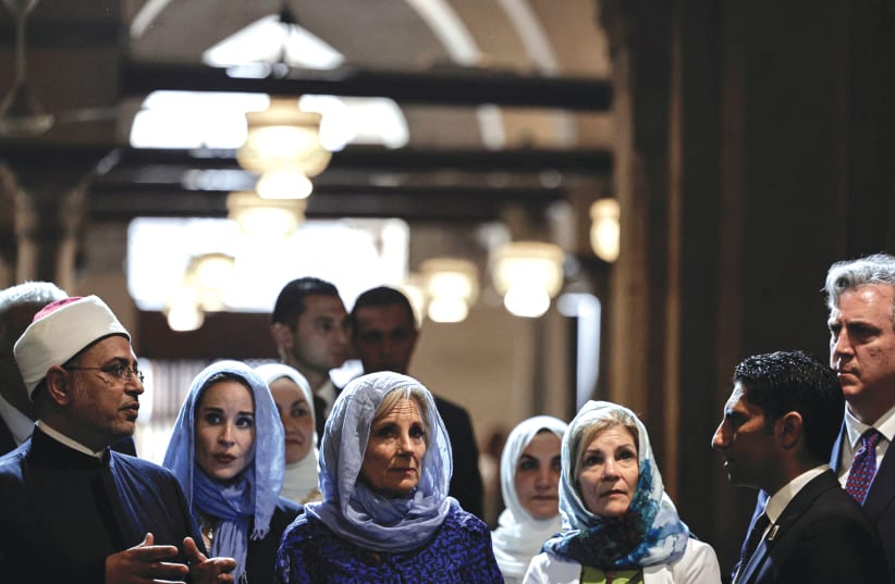  US FIRST LADY Jill Biden listens to the head of Al-Azhar University Mohamed Al-Mahrasawy (left) during her visit to Al-Azhar Grand Mosque in Cairo, earlier this year.  (photo credit: Khaled Desouki/Reuters)