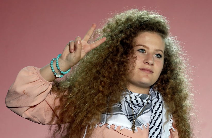  Palestinian teenager Ahed Tamimi, gives a peace sign following her speech at the annual festival of Greek Communist Youth in Athens, Greece, September 22, 2018. (photo credit: REUTERS/COSTAS BALTAS)