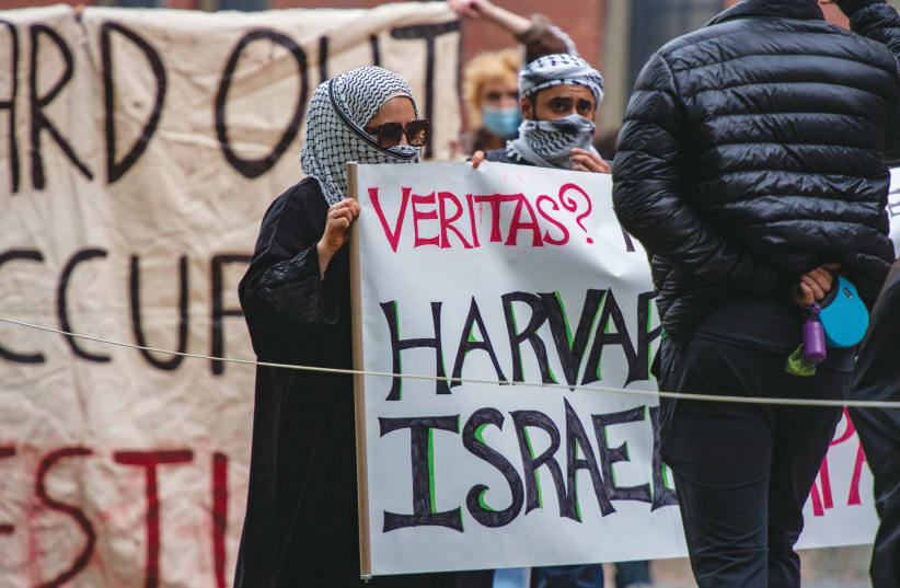  PALESTINIAN SUPPORTERS gather in Harvard Yard; ‘Veritas’ on the sign refers to Harvard University’s motto, ‘truth’ in Latin. (photo credit: Joseph Prezioso/AFP via Getty Images)