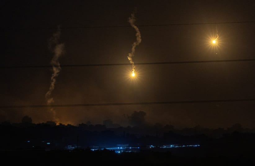  Flares burn in the sky as seen from the Israeli side of the border with Gaza, in southern Israel, November 9, 2023. (photo credit: EVELYN HOCKSTEIN/REUTERS)