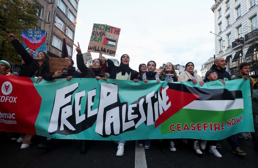 People take part in a protest in support of Palestinians in Gaza, as the conflict between Israel and Palestinian terrorist group Hamas continues, in Brussels, Belgium, November 11, 2023.  (photo credit: YVES HERMAN/REUTERS)
