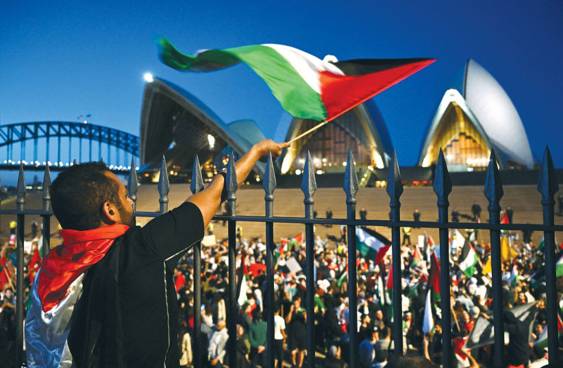  A PRO-PALESTINIAN rally is held outside Sydney Opera House, last month. From Sydney to New York, thousands called for the genocide of millions of Jews, celebrating October 7 as an act of defiance against evil. (photo credit: Australian Associated Press/Reuters)