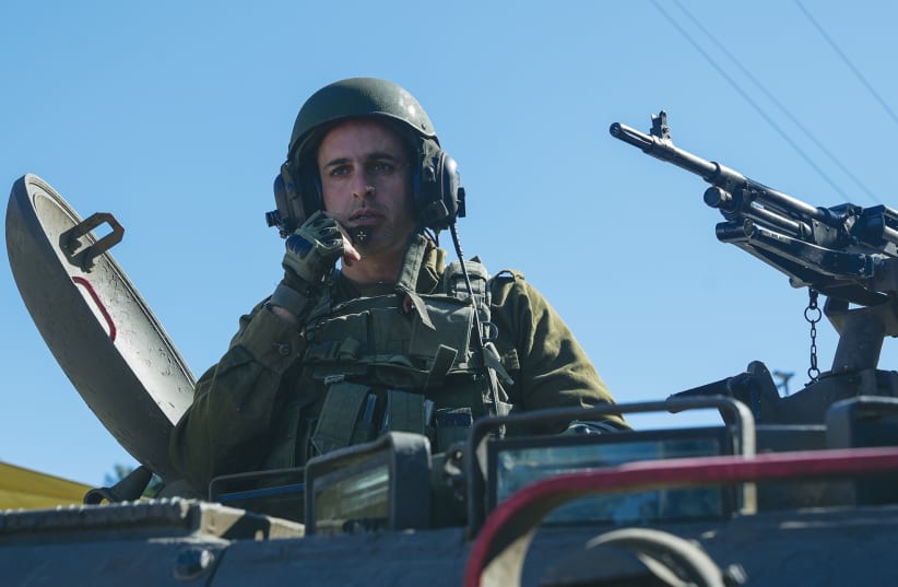  AN IDF SOLDIER is seen in an armored personnel carrier at a staging area near the border with Lebanon last week. According to accepted principles of international law, an army goes to war only if warfare is the only way to enable life to go on. (photo credit: AYAL MARGOLIN/FLASH90)