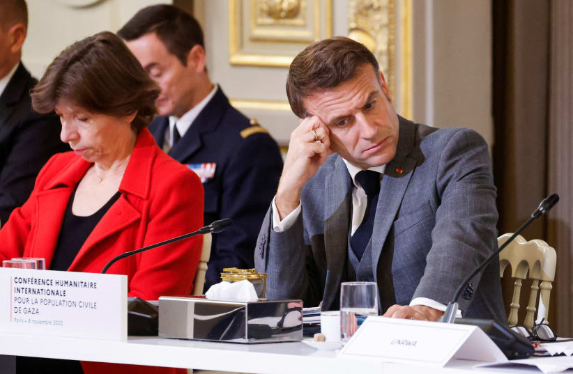  French President Emmanuel Macron looks down next to French Foreign and European Affairs Minister Catherine Colonna during an international humanitarian conference for civilians in Gaza, at the Elysee Presidential Palace, in Paris, France, on November 9, 2023. (photo credit: LUDOVIC MARIN/POOL VIA REUTERS)