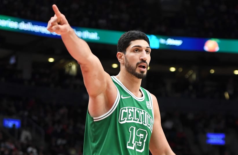 Former Boston Celtics center Enes Kanter Freedom gestures as he reacts to an officials call against Toronto Raptors in the second half at Scotiabank Arena. Nov 28, 2021. (photo credit: DAN HAMILTON-USA TODAY SPORTS)