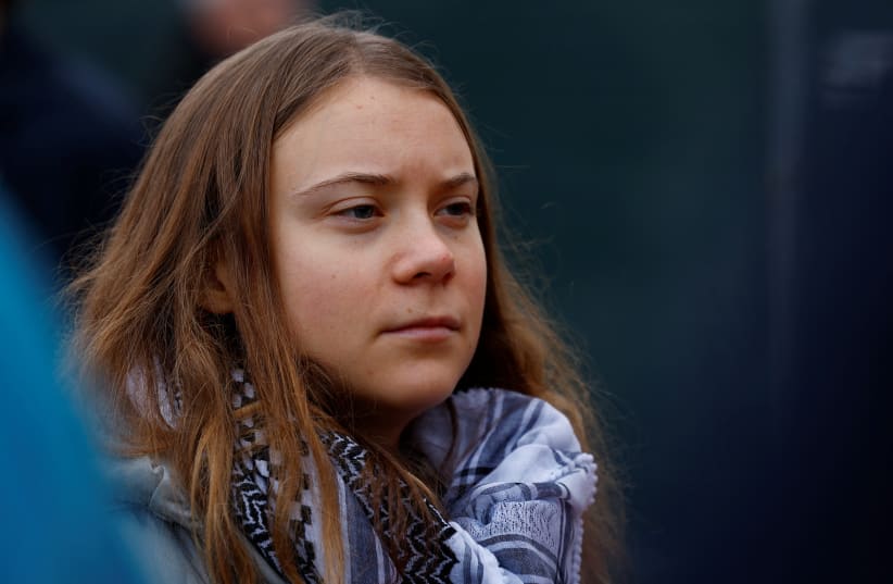  Greta Thunberg attends The March for Climate and Justice to demand political change before the elections in Amsterdam, Netherlands, November 12 2023.  (photo credit: REUTERS/PIROSCHKA VAN DE WOUW)