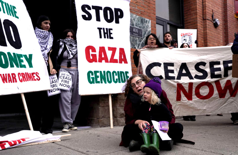  Members of the Jewish Voice for Peace group and allies rally in support of a ceasefire in the ongoing conflict between Israel and the Palestinian group Hamas, during a protest in Detroit, Michigan, U.S., November 7, 2023. (photo credit: REUTERS/DIEU-NALIO CHERY)