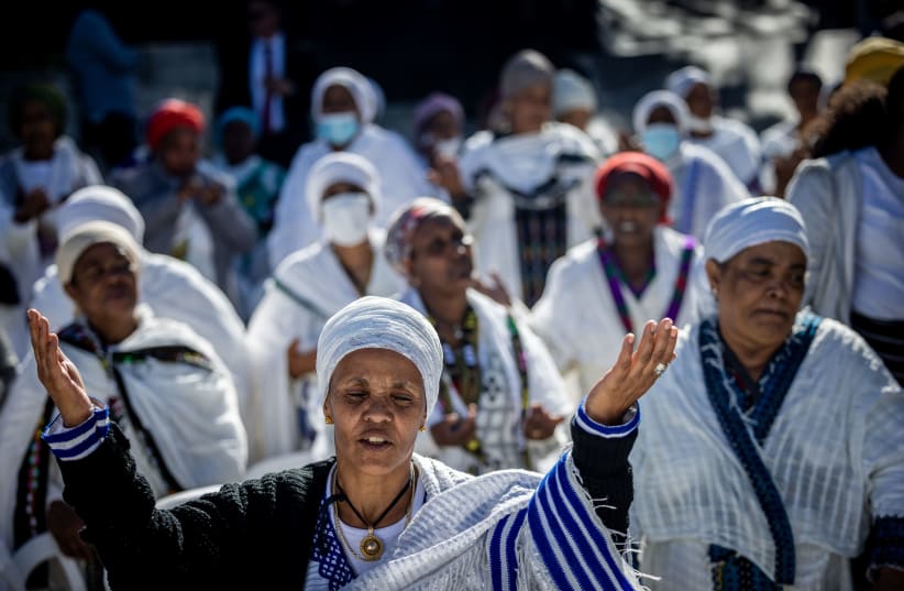  Thousands of Ethiopian Jews take part in a prayer of the Sigd holiday on the Armon Hanatziv Promenade overlooking Jerusalem on November 23, 2022. The prayer is performed by Ethiopian Jews every year to celebrate their community's connection and commitment to Israel.  (photo credit: YONATAN SINDEL/FLASH90)
