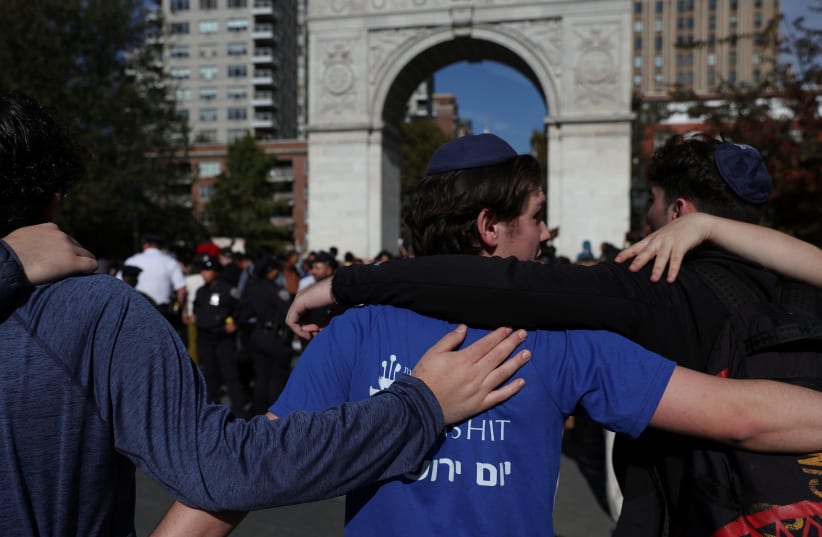  Counter-protesters gather as others attend a demonstration against Israel, amid the ongoing conflict between Israel and Hamas, as part of a student walkout by students of New York University, in New York City, U.S., October 25, 2023. (photo credit: REUTERS/SHANNON STAPLETON)