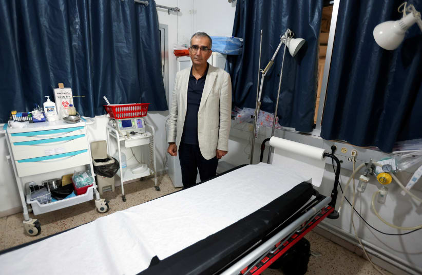 Mounes Klakesh, director of Marjayoun hospital, stands as he attends an interview with Reuters at the hospital in Marjayoun, southern Lebanon November 13, 2023 (photo credit: AZIZ TAHER/REUTERS)