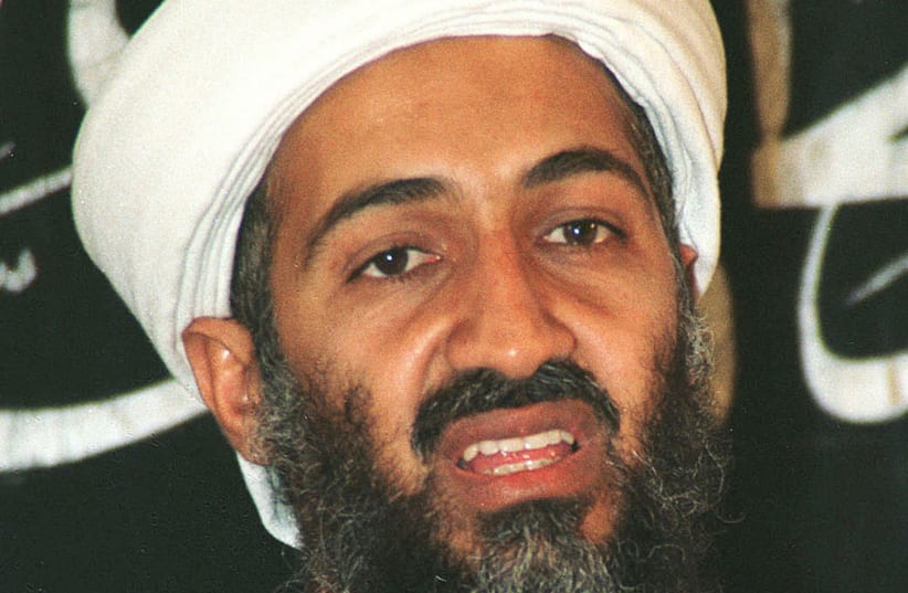 The Arabic-language television station al-Jazeera said November 12, 2002 that Saudi-born dissident Osama bin Laden, shown in Afghanistan in this May 26, 1998 file photo, has hailed recent anti-Western attacks in Bali, Kuwait and Yemen, and last month's hostage-taking in Moscow. The television said b (photo credit: REUTERS/STRINGER)