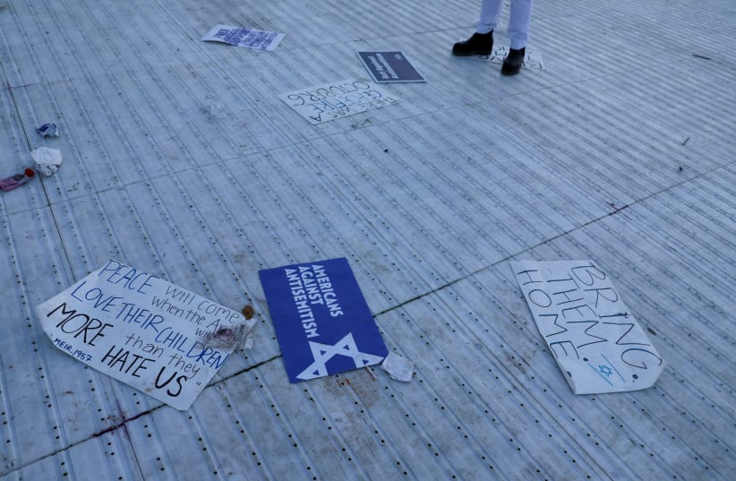  Placards lie on the ground after Israeli Americans and supporters of Israel gather in solidarity with Israel and protest against antisemitism, on the National Mall in Washington, U.S, November 14, 2023. (photo credit: REUTERS/LEAH MILLIS)
