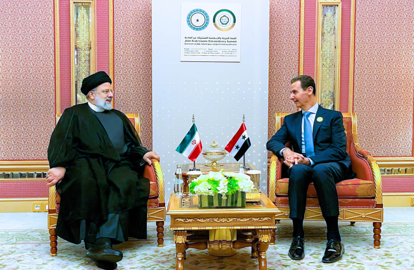  Iranian President Ebrahim Raisi meets with Syria's President Bashar Al-Assad in Riyadh, Saudi Arabia, November 11, 2023 (photo credit: Iran's Presidency/West Asia News Agency/Reuters)
