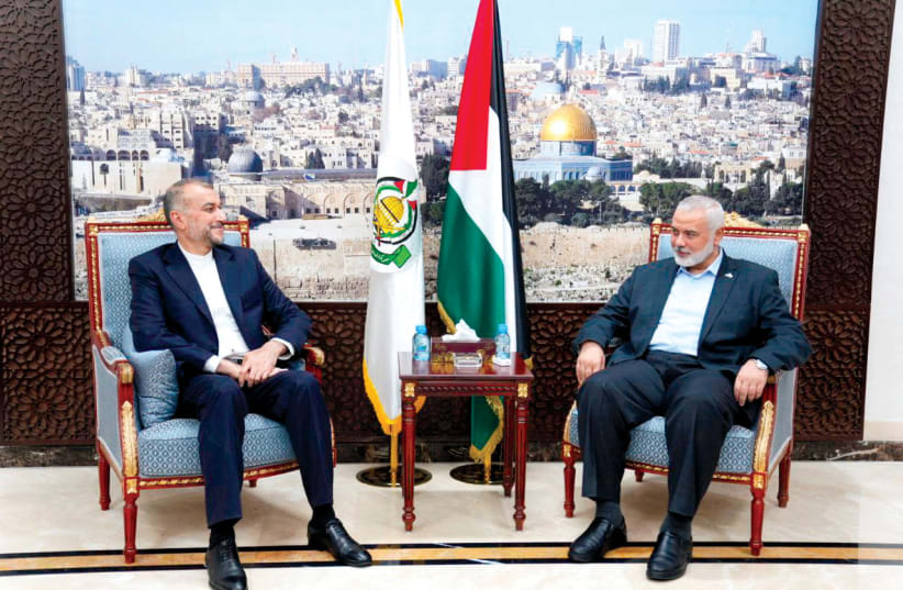  Iran’s Foreign Minister Hossein Amir Abdollahian meets Hamas political leader Ismail Haniyeh in Doha, Qatar, on October 14.  (photo credit: WANA/REUTERS)
