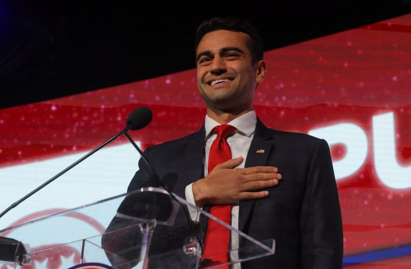 Republican candidate for Arizona Attorney General Abe Hamadeh speaks at the Republican Party of Arizona's 2022 U.S. midterm elections night rally in Scottsdale, Arizona, U.S., November 8, 2022. (photo credit: BRIAN SNYDER/REUTERS)