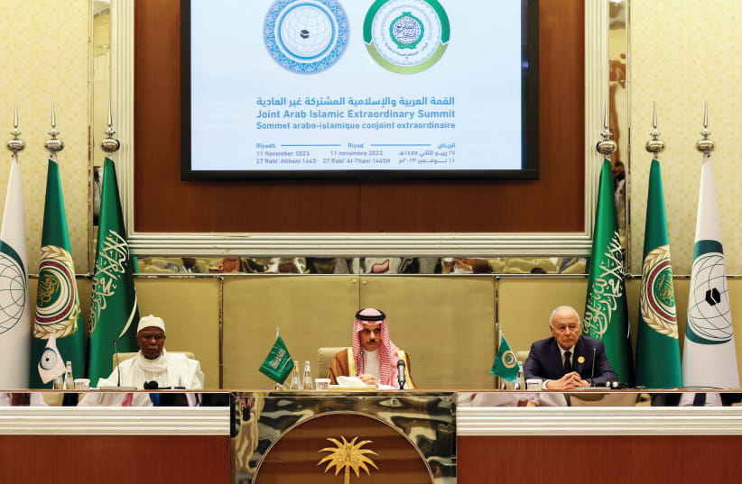 THE SECRETARIES-GENERAL of the Organization of the Islamic Cooperation (left) and the Arab League, with Saudi Arabia's foreign minister between them, hold a news conference at the joint Arab-Islamic summit in Riyadh, on November 11 (photo credit: AHMED YOSRI/ REUTERS)