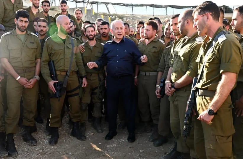 He will persist in misleading the public as usual. Prime Minister Benjamin Netanyahu is seen with IDF forces during the course of the war (photo credit: CHAIM TZACH/GPO)