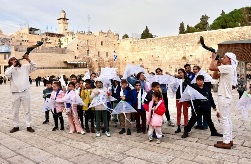 Israeli children fly kites in the Western Wall on November 19, 2023 (photo credit: THE GINOGLI MUNICIPAL CENTER OF THE CULTURE AND ARTS DEPARTMENT OF THE JERUSALEM MUNICIPALITY,)