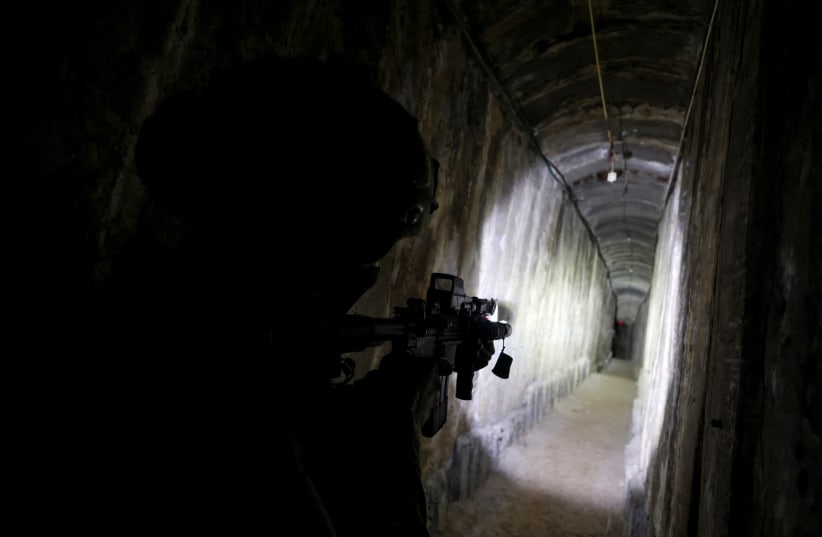  An IDF soldier secures a tunnel underneath Al Shifa Hospital in Gaza City, amid the ongoing ground operation of the Israeli army against Palestinian Islamist group Hamas, in the northern Gaza Strip, November 22, 2023. (photo credit: RONEN ZVULUN/REUTERS)