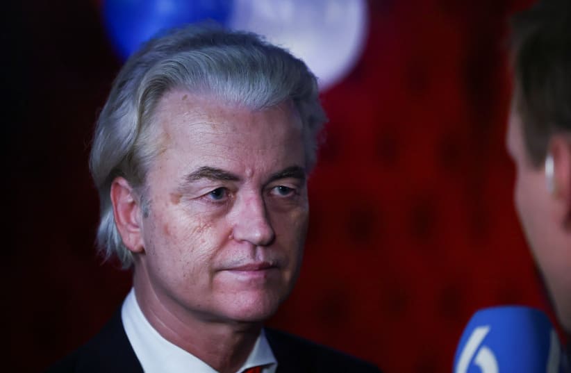  Dutch far-right politician and leader of the PVV party, Geert Wilders speaks to the press following the exit poll and early results in the Dutch parliamentary elections, in The Hague, Netherlands November 22, 2023 (photo credit: REUTERS/YVES HERMAN)