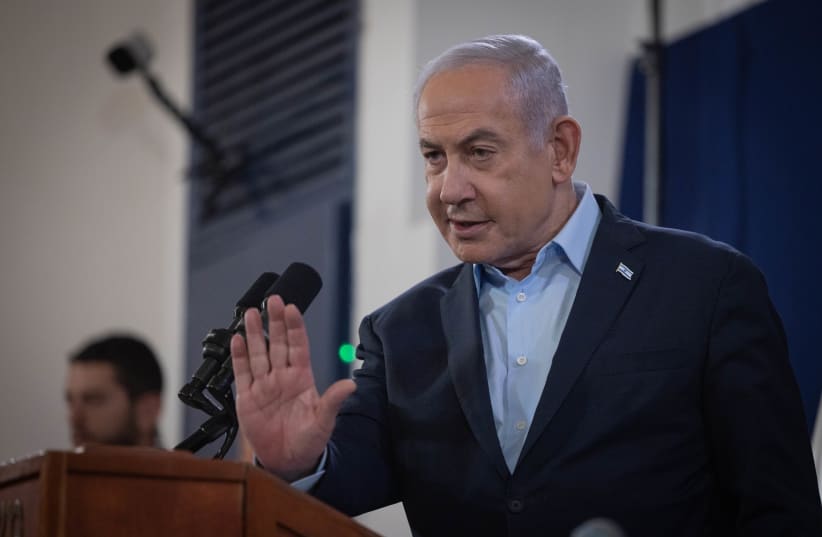 Prime Minister Benjamin Netanyahu attends a press conference at the Defense Ministry in Tel Aviv. November 22, 2023 (photo credit: Chaim Goldberg/Flash90)