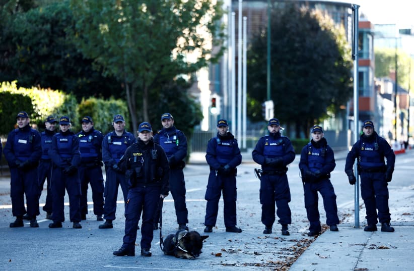 Gardai (Police) block the road beside the Israeli embassy as demonstrators rally during a "Stand with Palestine" march in solidarity with Gaza, in Dublin, Ireland, October 14, 2023. (photo credit: CLODAGH KILCOYNE/REUTERS)