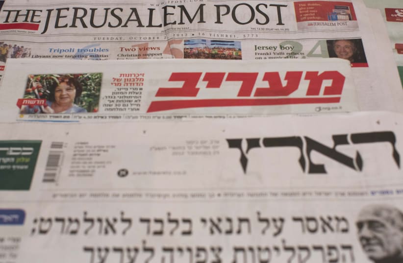  An illustration of israel daily newspapers, including The Jerusalem Post, Maariv and Haaretz. Taken October 13, 2012 (photo credit: YONATAN SINDEL/FLASH90)