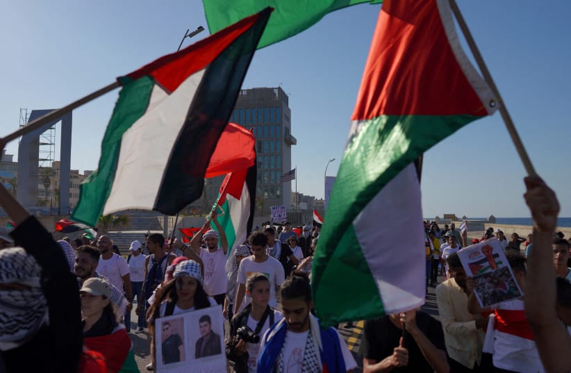  People march nearby the US Embassy in support of Palestinians, calling for a ceasefire and for charging Israel with committing “genocide” in Gaza, in Havana, Cuba, November 23, 2023. (photo credit: REUTERS/ALEXANDRE MENEGHINI)