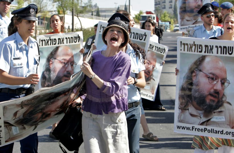 An Israeli protester shouts while holding a poster of Jonathan Pollard, who was convicted for spying on the United States in 1987, in front of the Israeli Prime Minister's office in Jerusalem June 19, 2005. (photo credit: REUTERS/AMMAR AWAD)