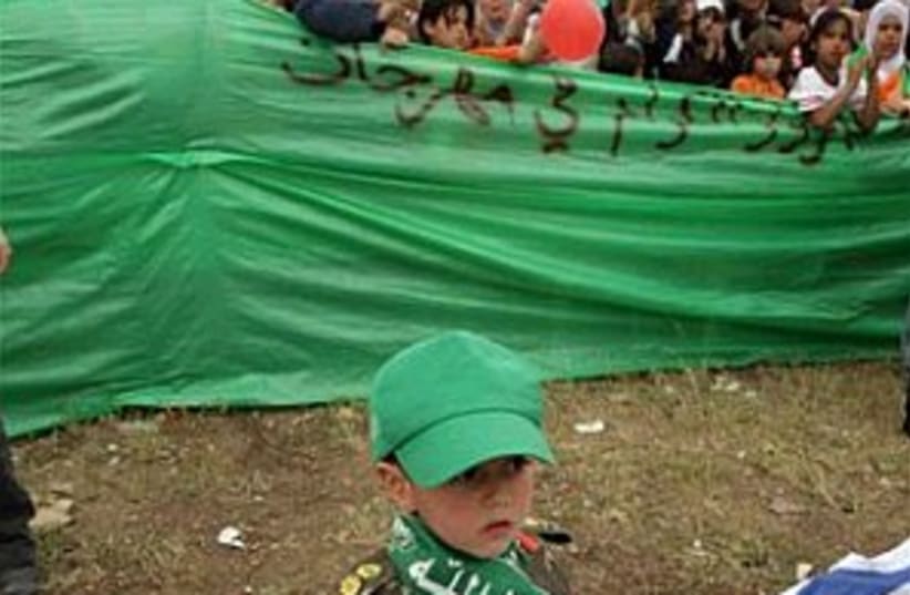 hamas kid, israeli flag (photo credit: AP [file])