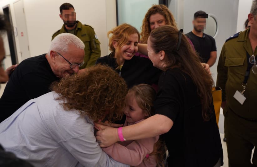 Emilia and Danielle Aloni smile as they are reunited with their family. (photo credit: IDF SPOKESPERSON UNIT)