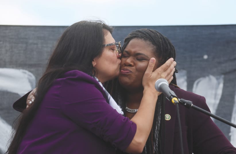  US REP. Rashida Tlaib (left) kisses Rep. Cori Bush as they take part in a protest outside the US Capitol in Washington last month, calling for a ceasefire in Gaza.  (photo credit: LEAH MILLIS/REUTERS)