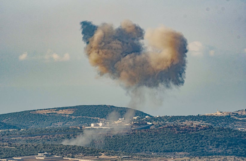  Smoke rises during an exchange of fire between the IDF and Hezbollah on the border between Israel and Lebanon, earlier this month. (photo credit: AYAL MARGOLIN/FLASH90)