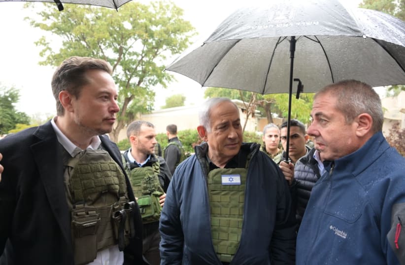  Elon Musk walks around the site of one of the many massacres committed by Hamas on October 7th. (photo credit: MAARIV)