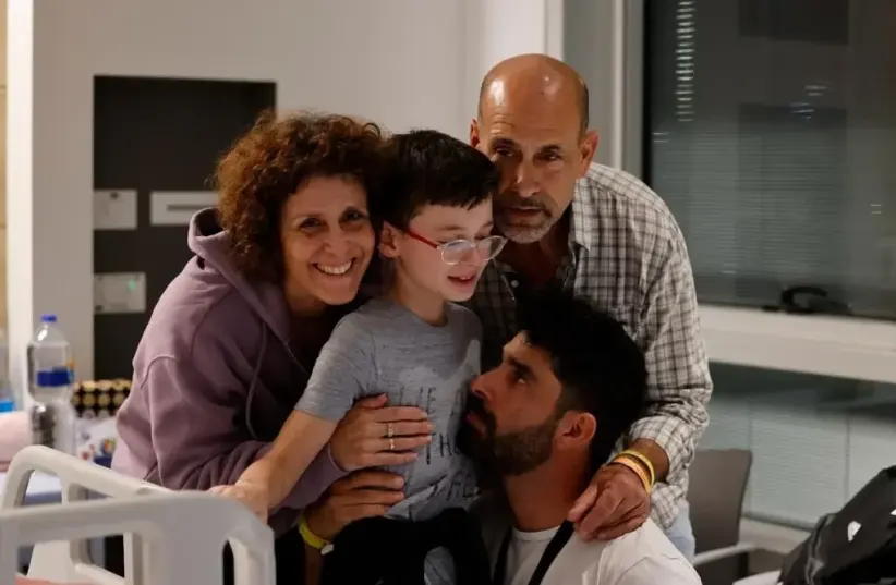  with them again. Ohad Monder and his family in the hospital after he was released from Hamas (photo credit: official site, The Schneider Hospital Spokesperson's Department)