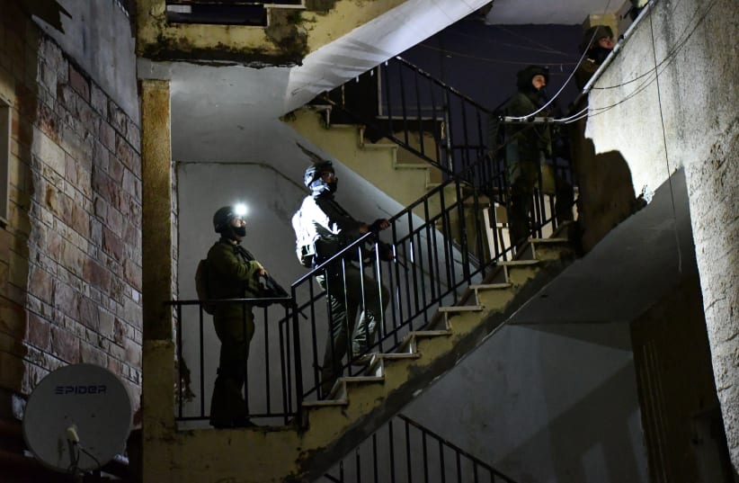  IDF soldiers prepare the home of a terrorist for demolition in the early morning hours of November 28 (photo credit: SETH J. FRANTZMAN)