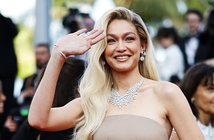  The 76th Cannes Film Festival - Screening of the film "Firebrand" (Le jeu de la reine) in competition - Red Carpet Arrivals - Cannes, France, May 21, 2023. Gigi Hadid poses. (photo credit: REUTERS/SARAH MEYSSONNIER)